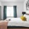 a bedroom with a bed and a fan