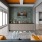 a living room with a glass wall