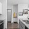 a kitchen with white cabinets
