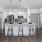 a kitchen with a table and stools